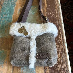 UGG sheep lined small purse. Leather and sheep skin outer. Brass.